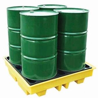 Close-up of four drum spill pallets with drums