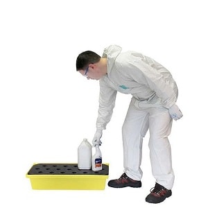 Man Placing a Bottle on a Small Spill Containment Poly Spill Tray